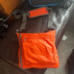 This orange Hikiss duffle bag small/huge convertible.